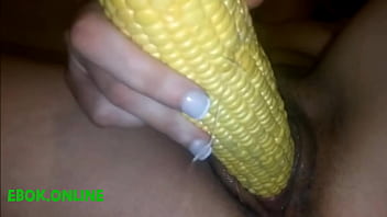 Masturbating their vagina with corn